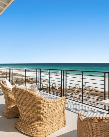 Balcony with wicker chairs overlooking the Gulf of Mexico