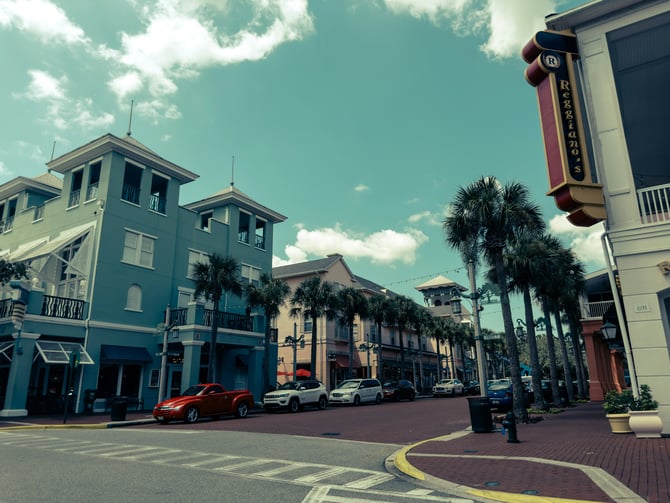 Colorful Florida beach town square with palm trees and shops